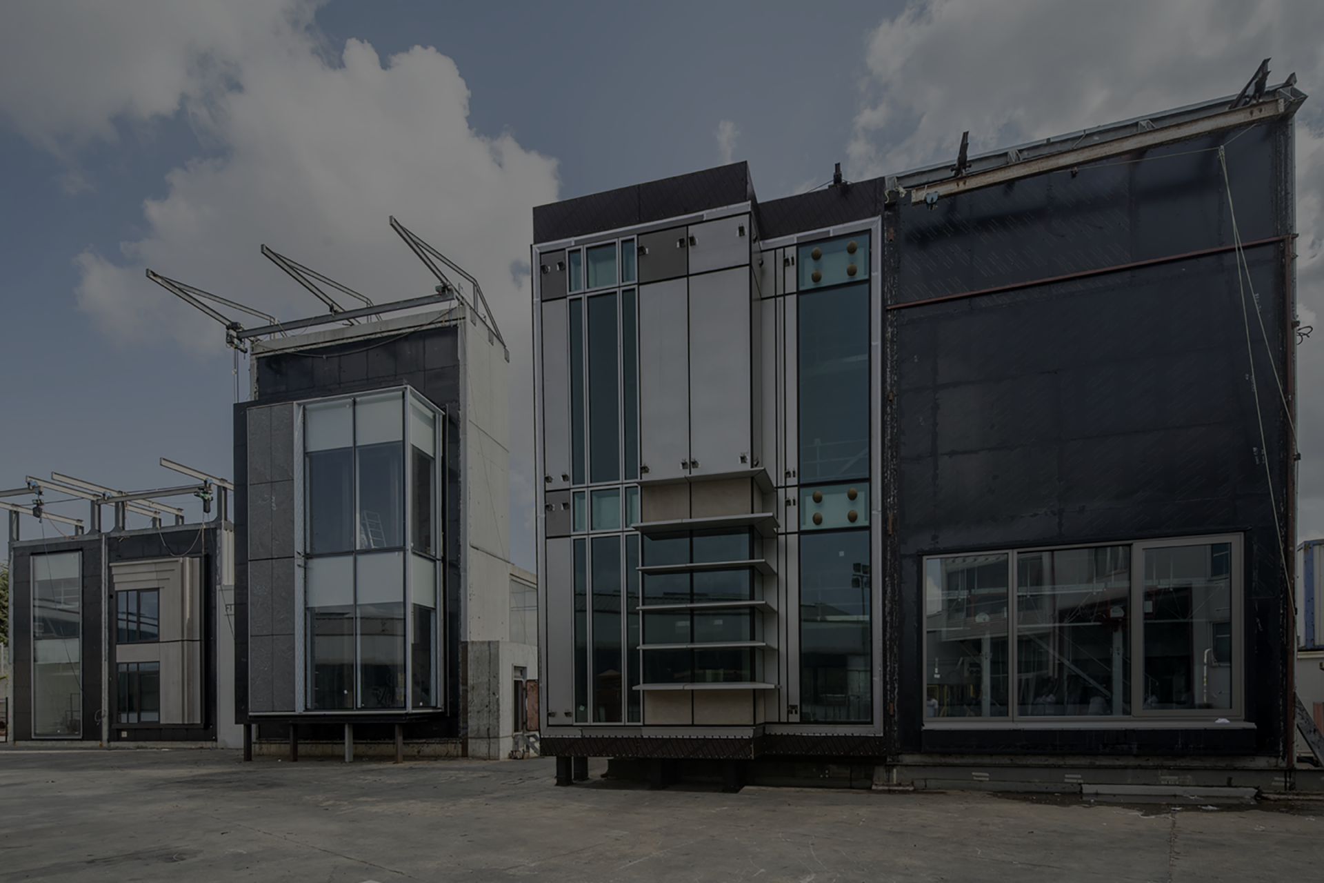 Full-scale façade mock-ups standing on the outdoor test rigs