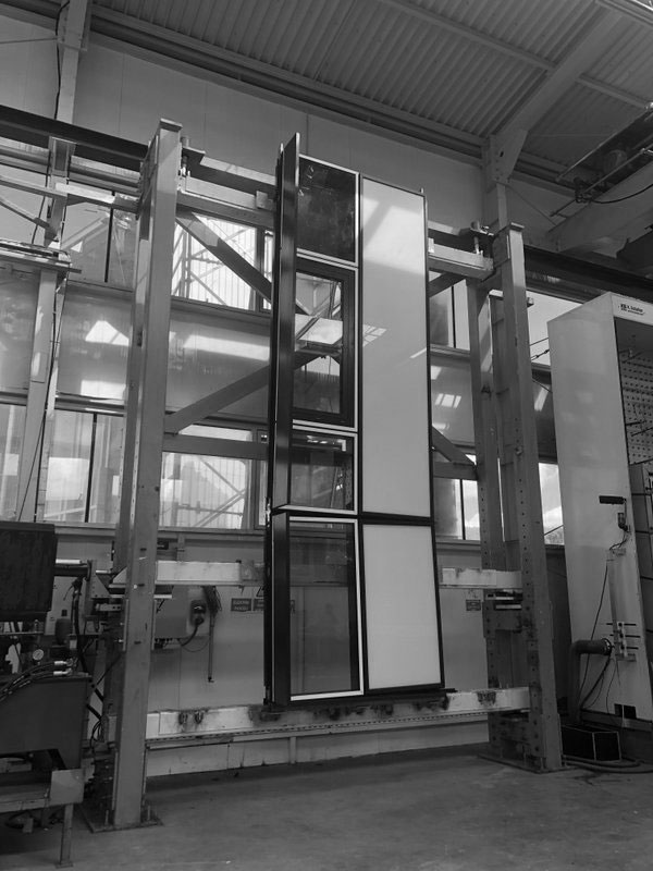 Window and panel specimen mounted in the seismic test rig
